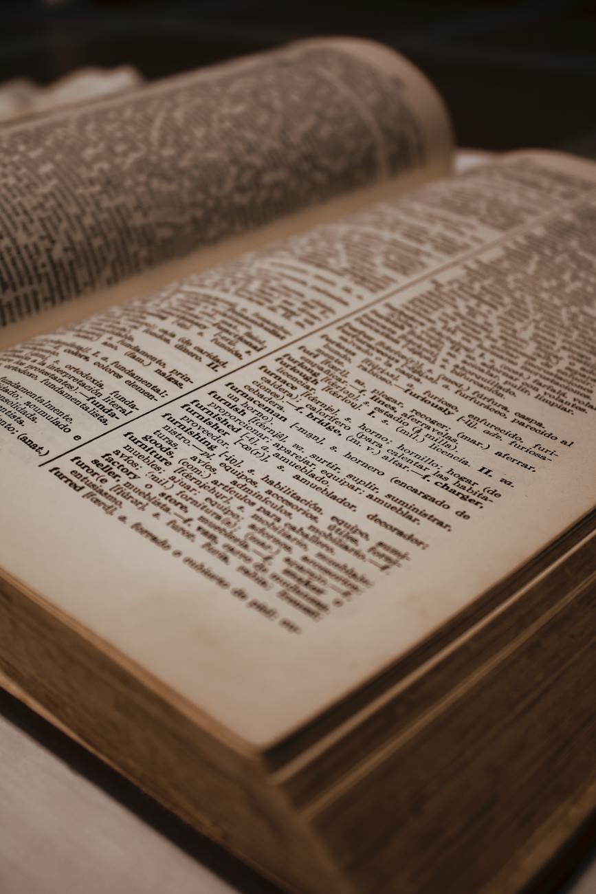 close up photo of pages of an old english spanish dictionary